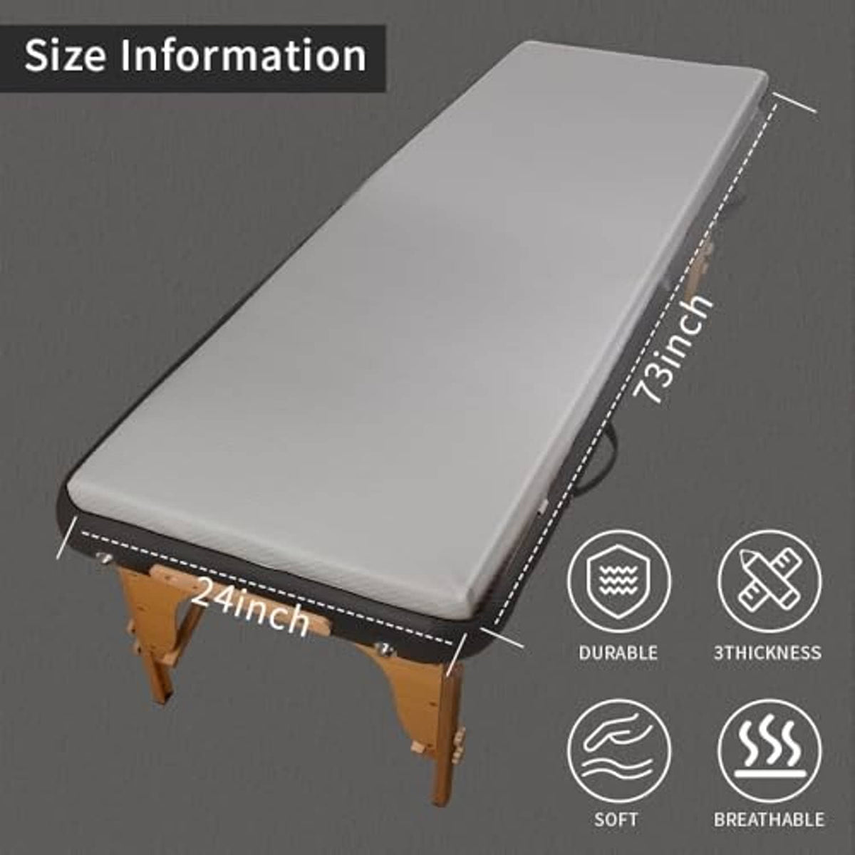 Grey massage table topper with smooth top and dark stitched side trim over the cushion