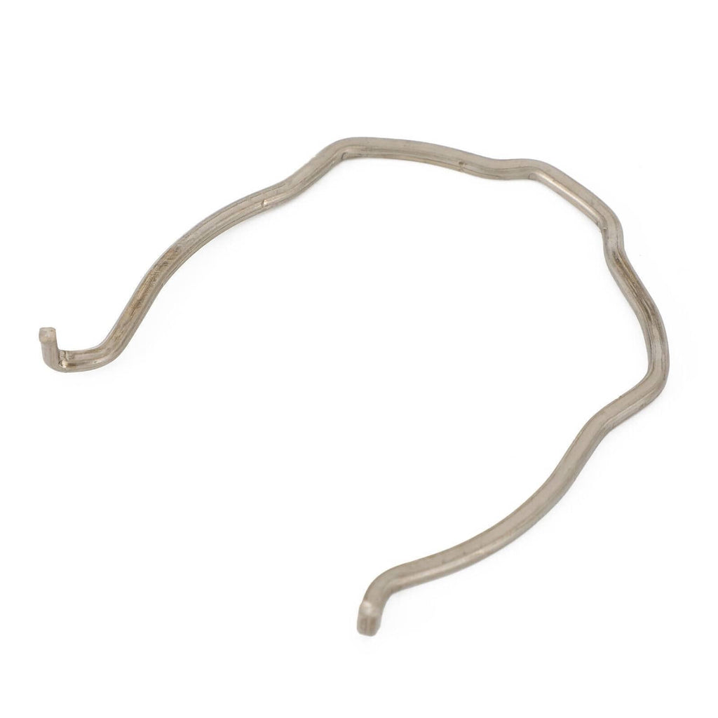 Gray metal gasket clip with two short legs, curved shape