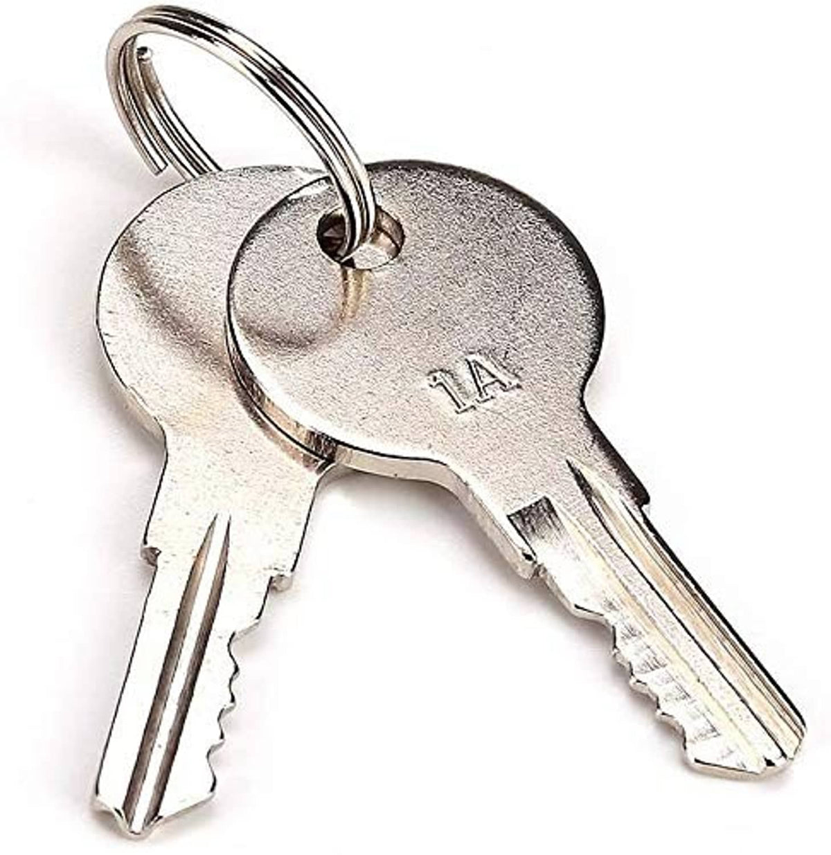 Metal ignition keys with keyring attached to a silver ignition switch cylinder