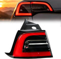 Rear driver-side LED tail light assembly with red lens and black housing.