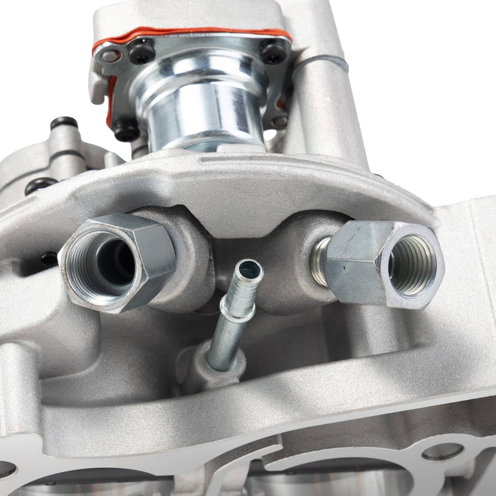 Throttle body inlet housing close-up with metal ports and mounting tabs