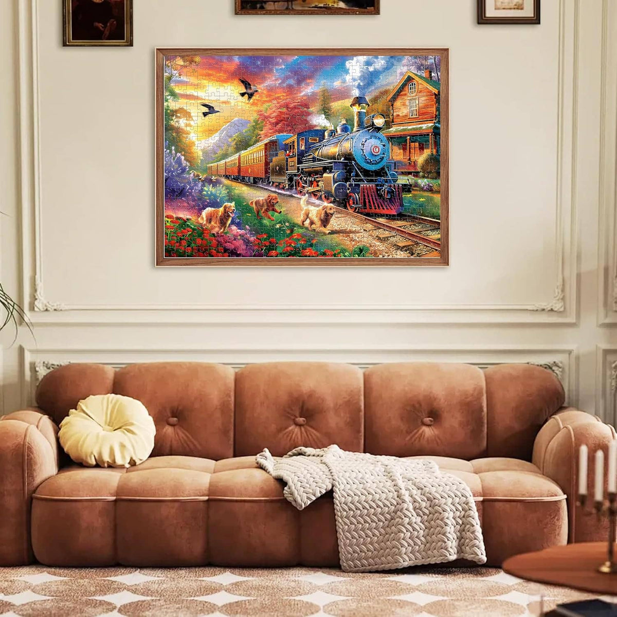 Framed completed jigsaw puzzle wall art with blue steam train and dogs in a garden