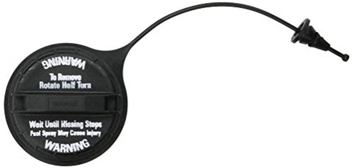 Fuel cap with tether line, black circular cover, warning text panel visible
