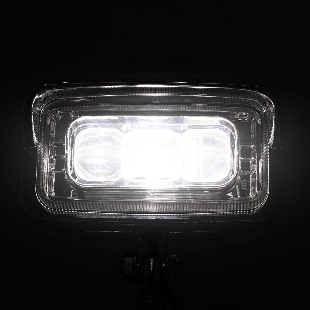 Rectangle LED headlight lit with a clear lens and chrome outer bezel