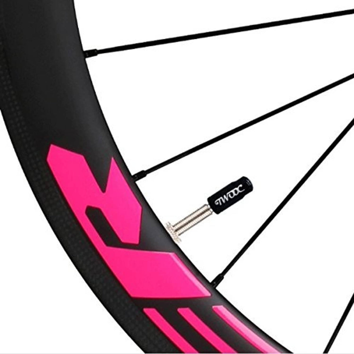 Valve core remover tool at bicycle rim with black handle and metal probe