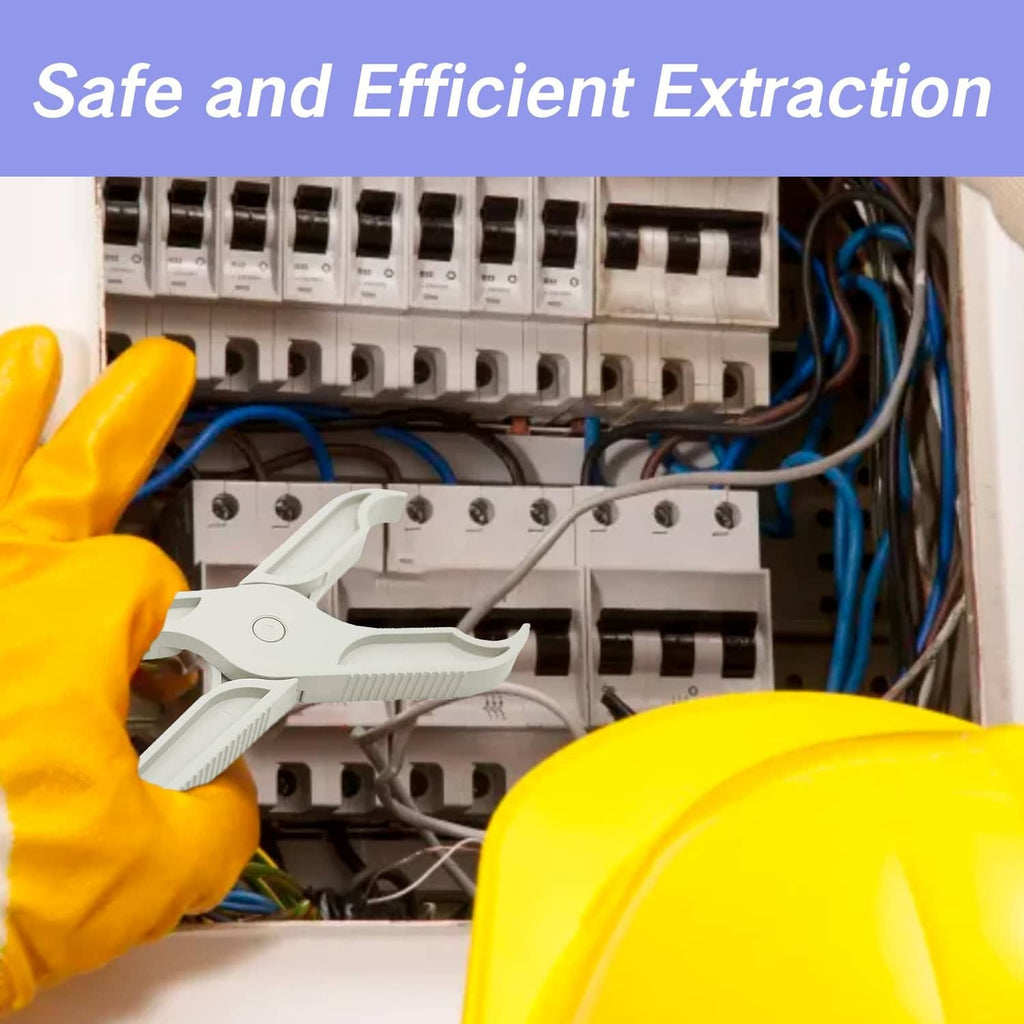 Grey insulated fuse puller tool in an electrical panel, gripped by hand