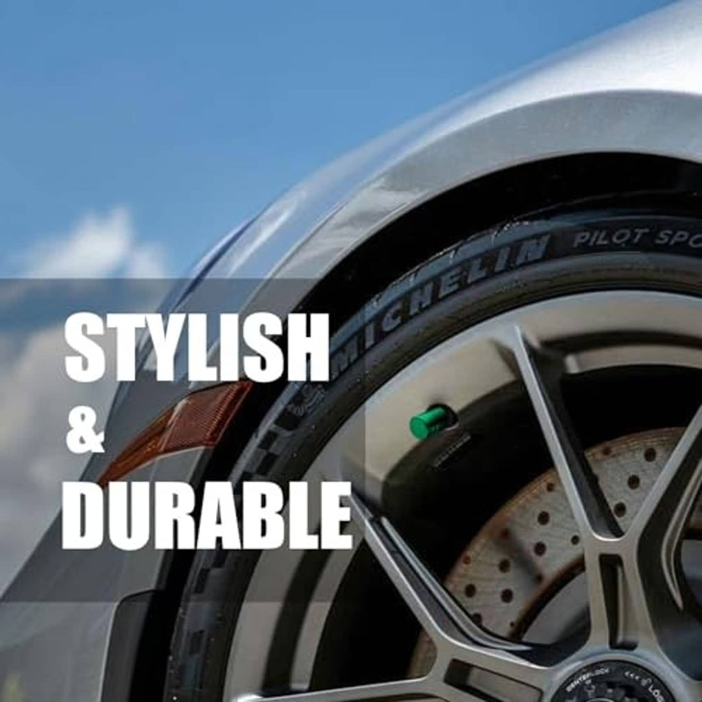 Green tire valve stem cap on a car wheel valve with black liner interior