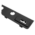 Dark gray seat switch trim bezel panel with circular hole and U-shaped slot