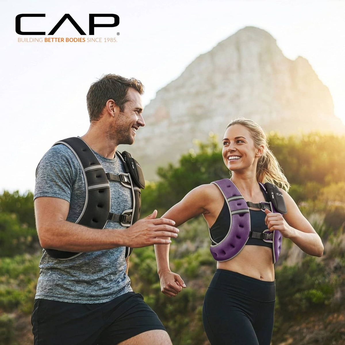 Two people wearing weighted vests: black vest and purple vest with reflective trim