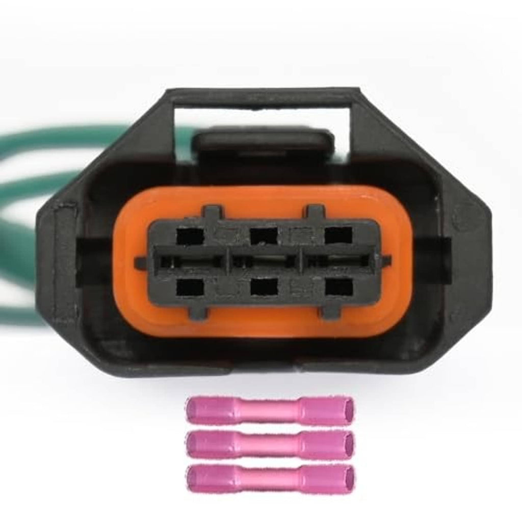 Orange 3-pin camshaft sensor connector close-up with black terminal block and purple pins