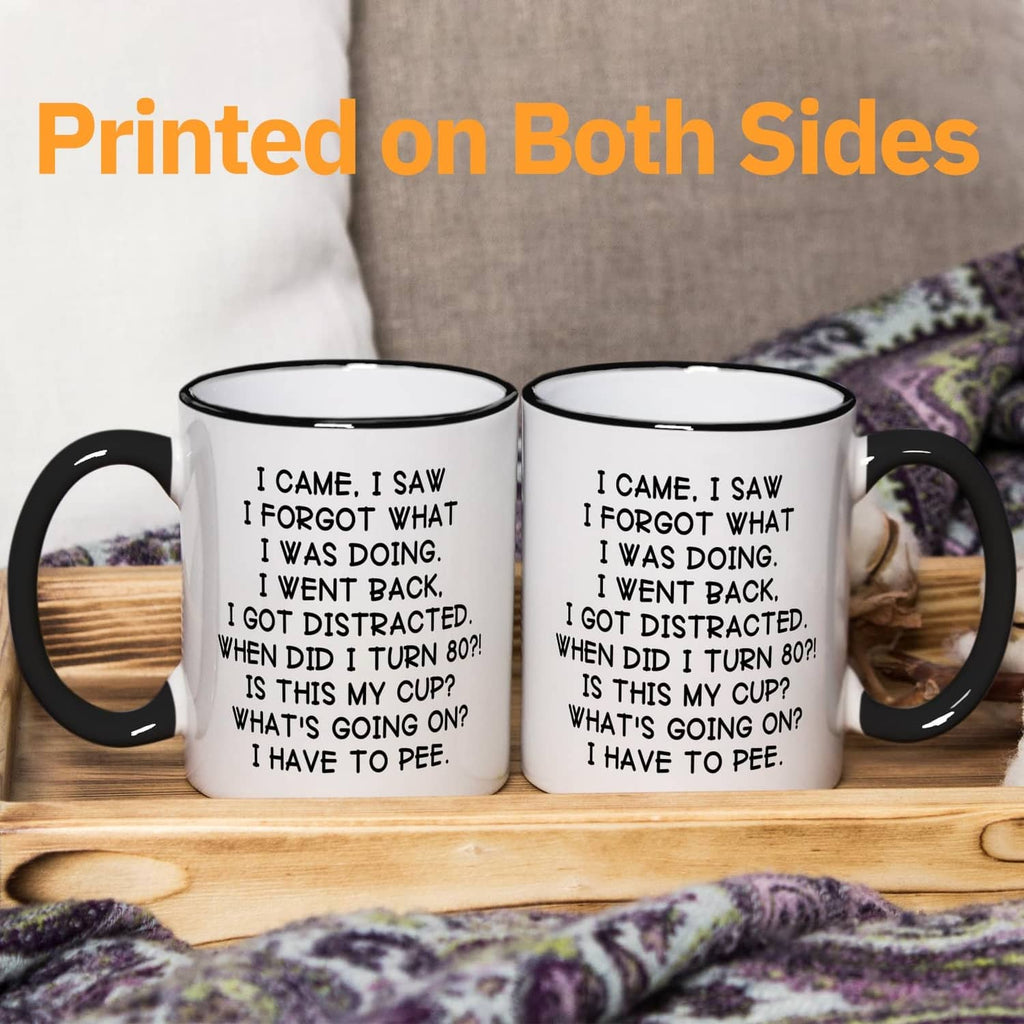 Pair of white mugs with black handles and rims, matching 'turn 80' quote on fronts.