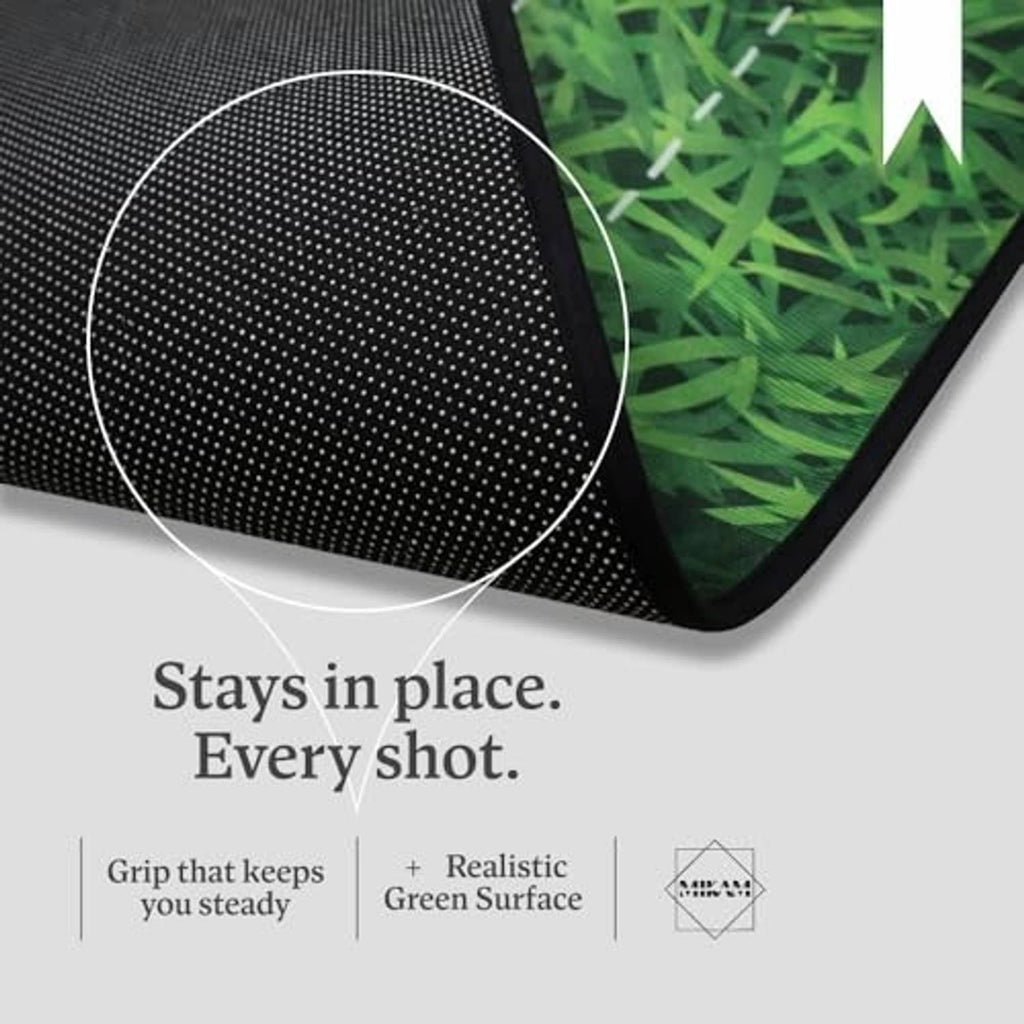 Golf putting mat corner with textured backing and white alignment markings on green grass