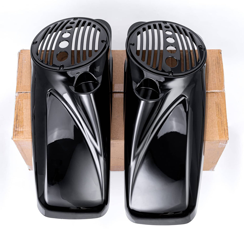 Black speaker lids with circular grille patterns, front view on cardboard backing