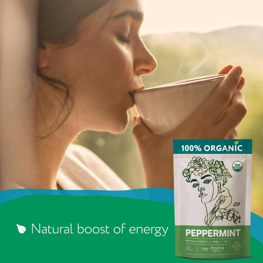 Organic peppermint tea pouch next to a cup of herbal tea