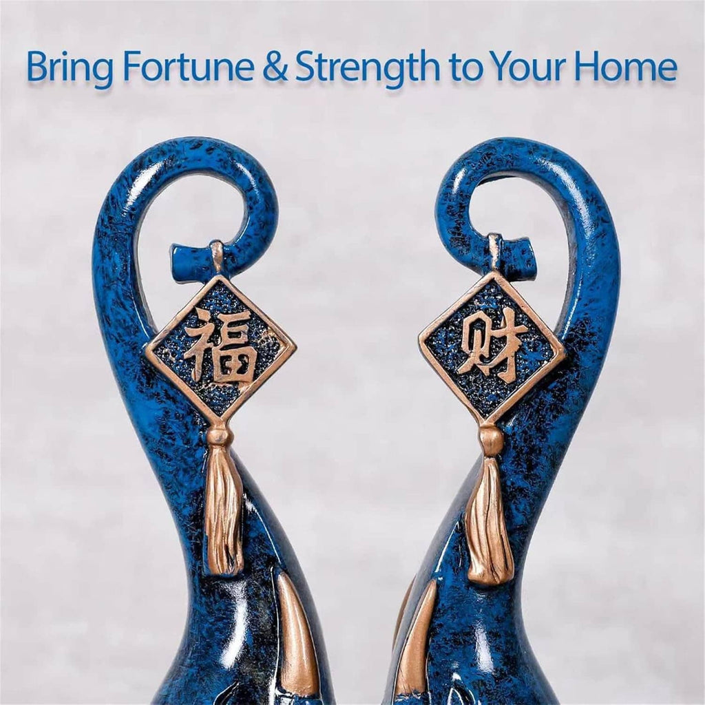 Pair of blue elephant luck statues with hanging diamond charms and gold tassels