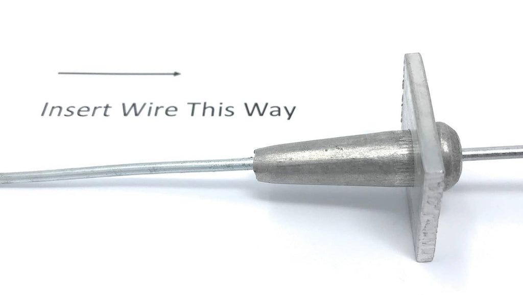 Metal wire anchor vise with flange plate and tapered insert, wire fed through