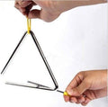 Steel triangle percussion instrument being struck by a hand-held mallet