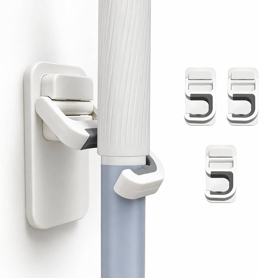 Wall-mounted mop holder hook holding a mop handle, white mount and gray base