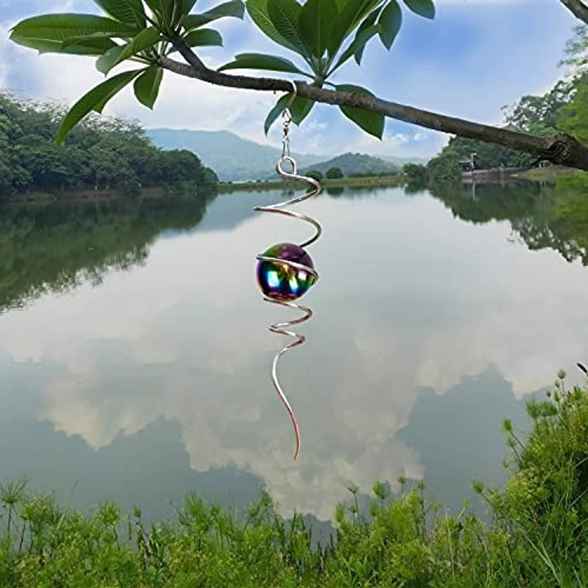 Hanging spiral wind spinner with iridescent multicolor gazing ball suspended on chain