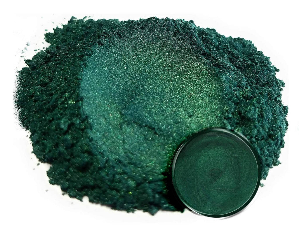 Loose dark green mica powder glitter mound with open jar lid