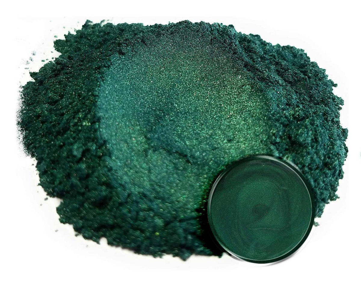 Loose dark green mica powder glitter mound with open jar lid