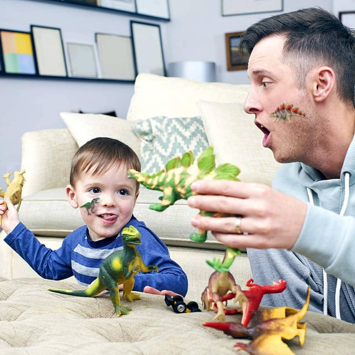 Dinosaur wall stickers in a living room while a dad and toddler play with toys