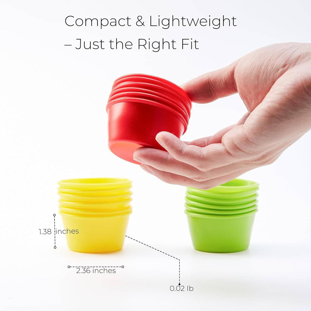Silicone puto mold cup held in hands; red cup with stacked yellow and green molds