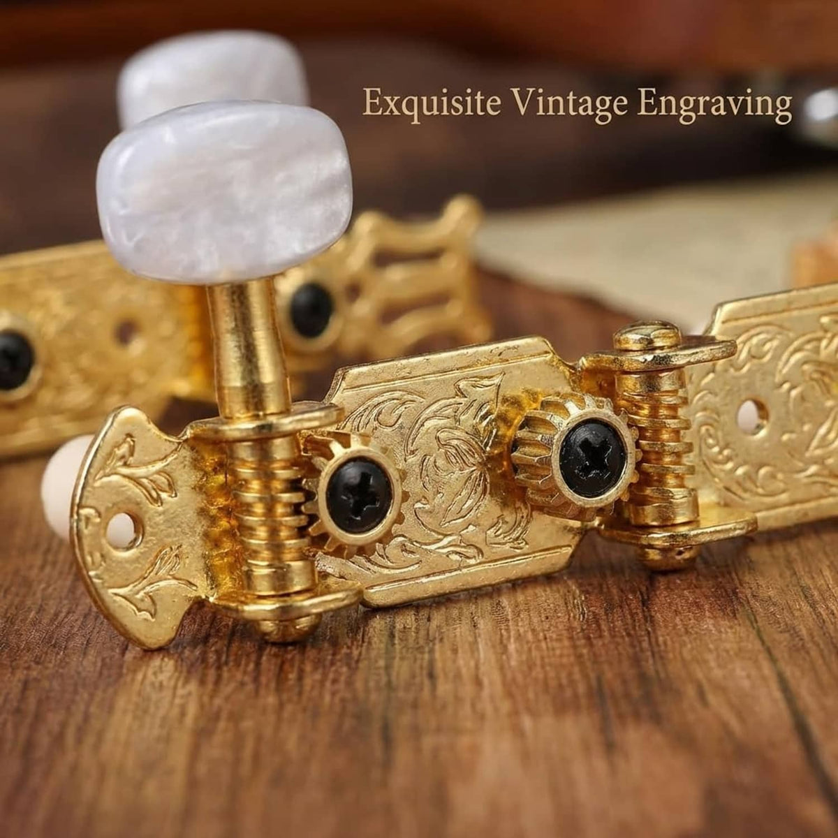 Ornate gold classical guitar tuning pegs with carved plate and black screw heads