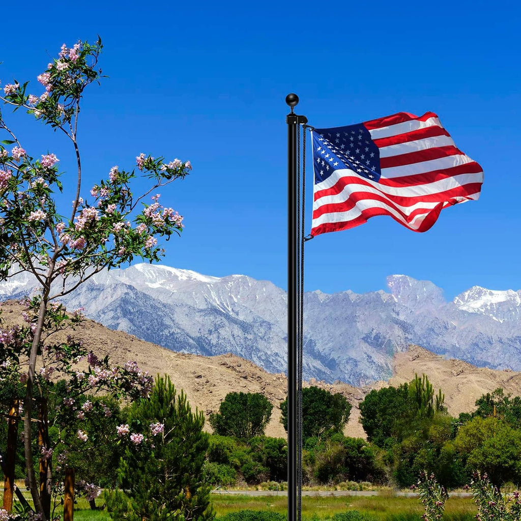 Flagpole rope kit holding a U.S. flag on a metal pole, with dark nylon halyard rope