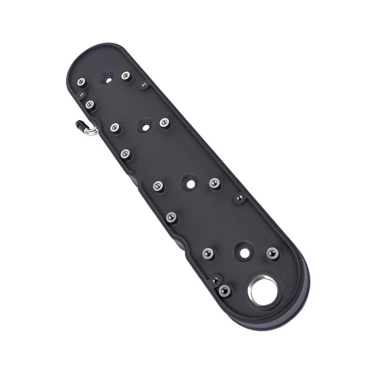 Black coil cover plate with bolt holes and circular opening near one end.