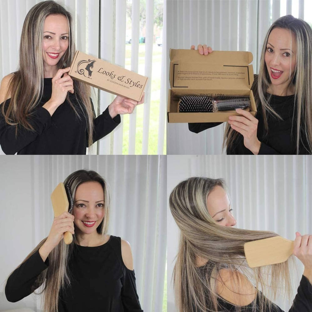 Wooden paddle hairbrush with black bristles in hand with product box