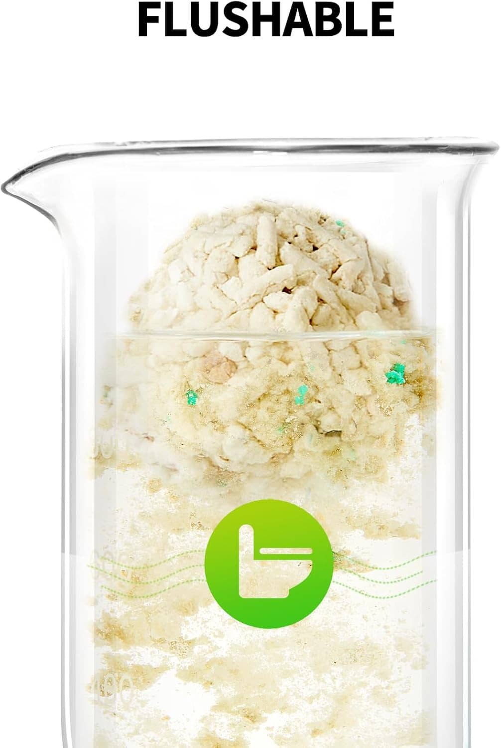 Flushable cat litter dissolving in a clear beaker