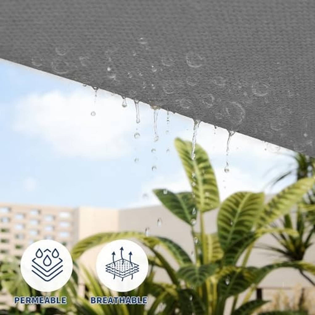 Dark grey shade sail underside with water droplets beading on fabric