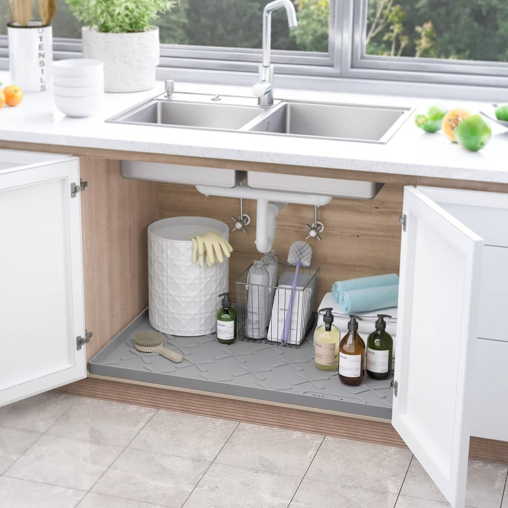 Gray under-sink silicone mat under kitchen sink, with raised texture for protection
