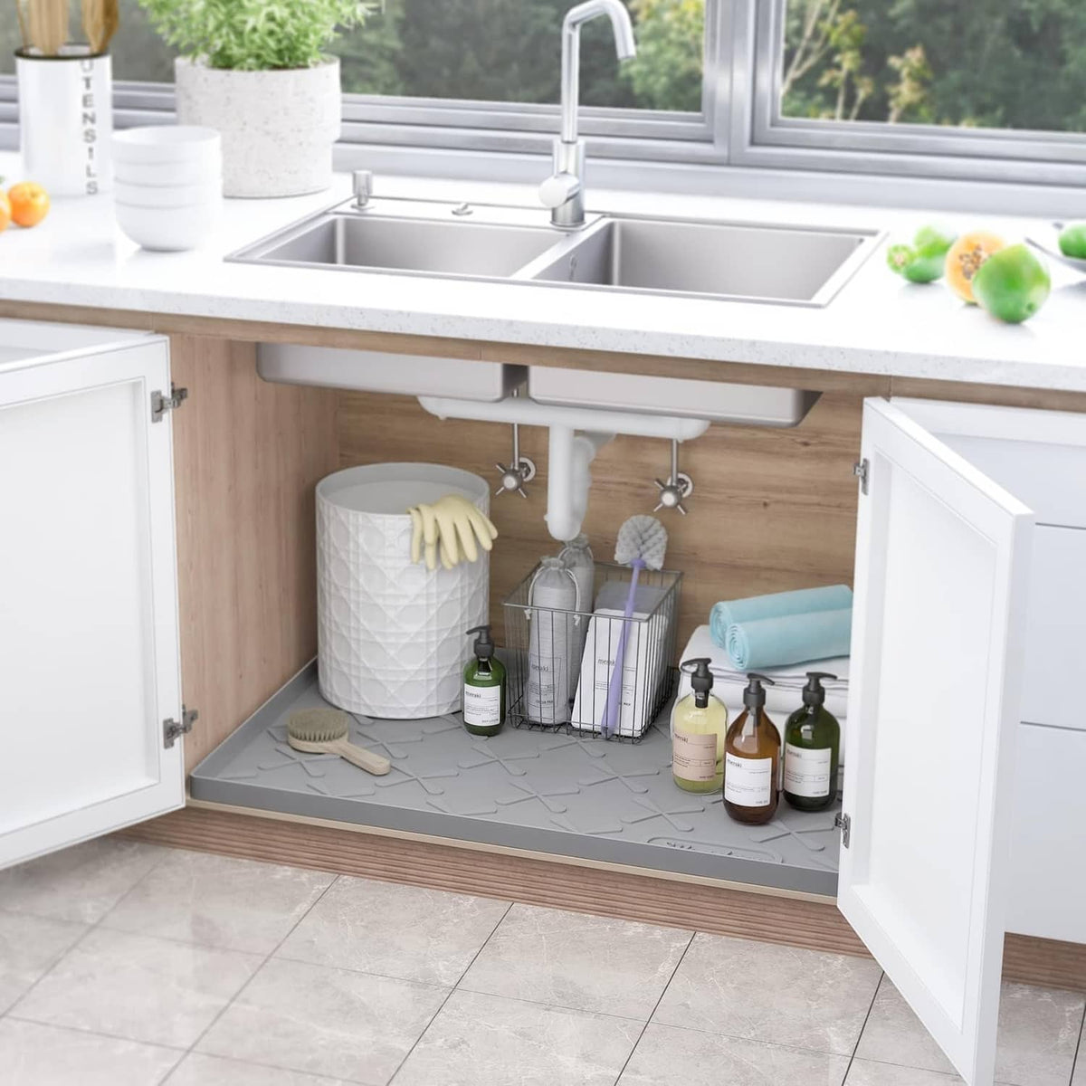 Gray under-sink silicone mat under kitchen sink, with raised texture for protection