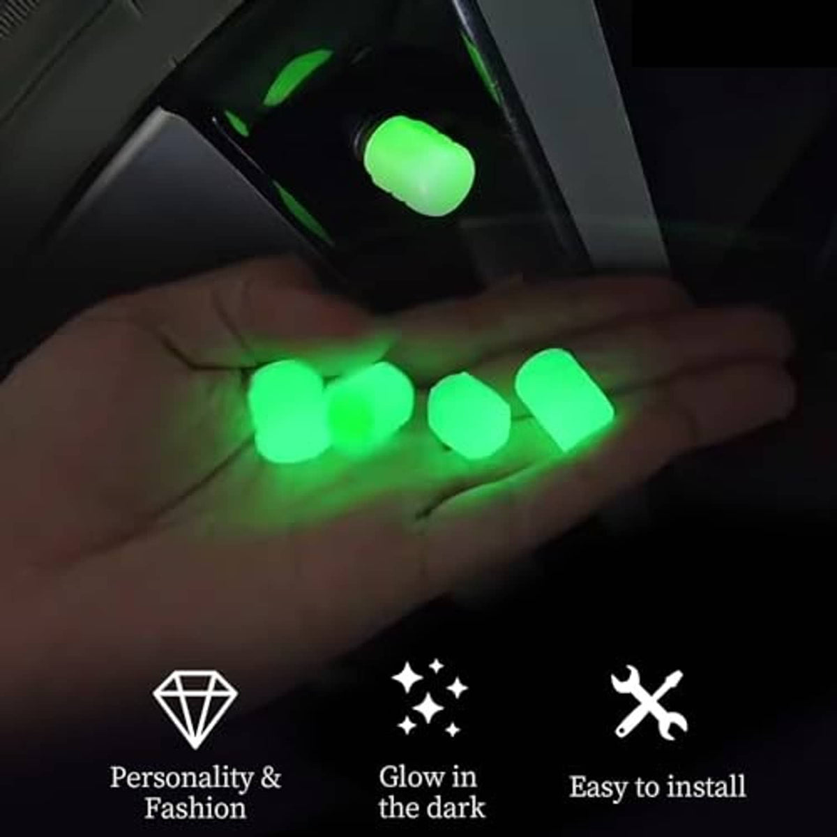 Glow-in-the-dark tire valve stem caps glowing green on a car tire valve
