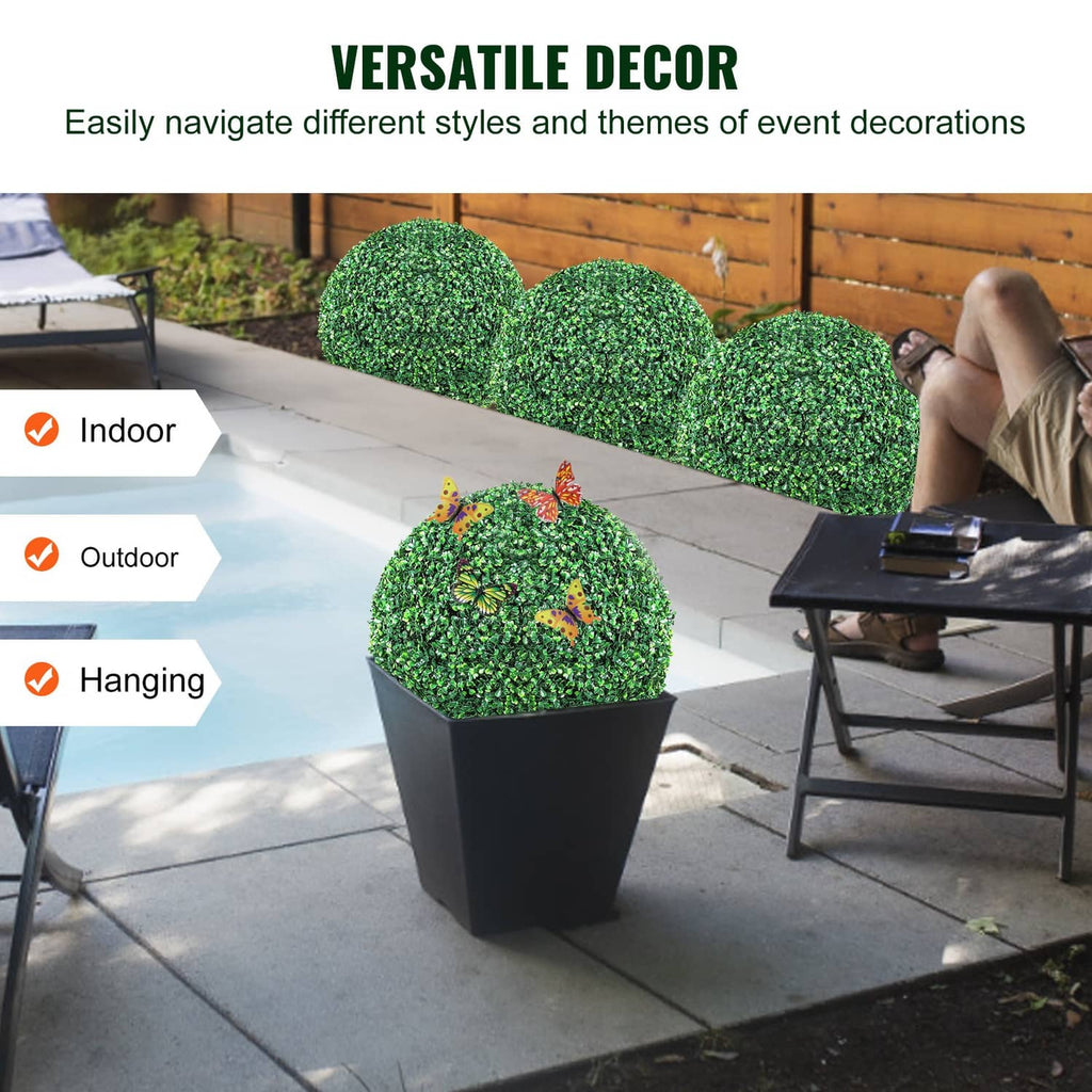 Artificial green topiary balls in planter for indoor or outdoor decor