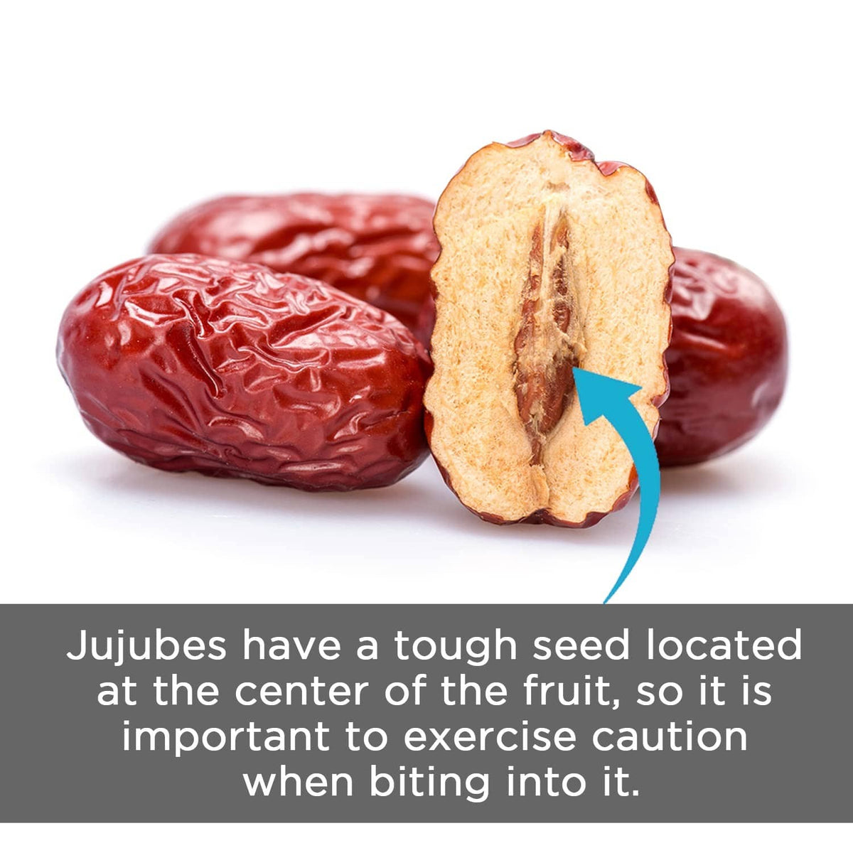 Dried red jujube dates with one split open to show the center