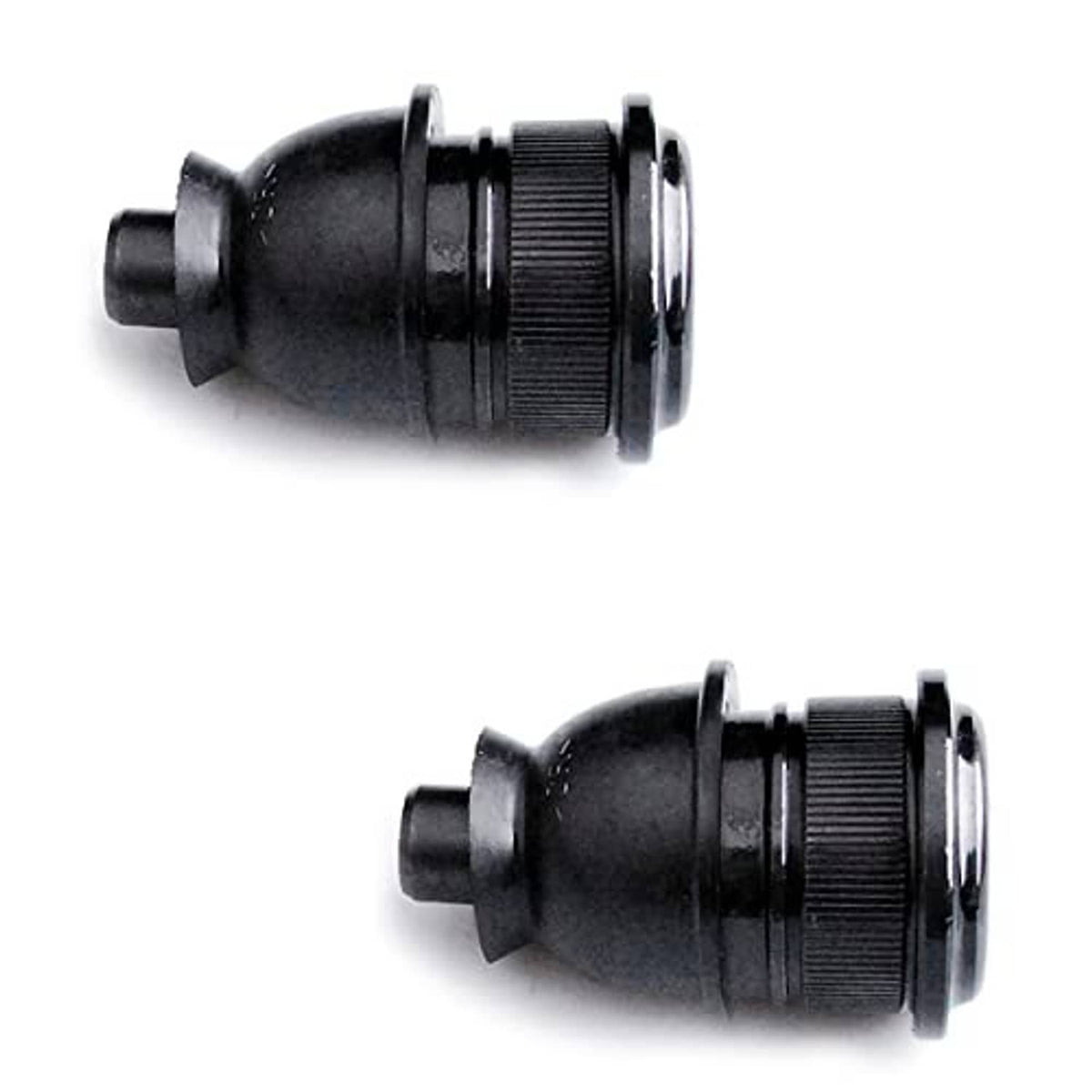 Close-up of two front ball joints with black rubber boots and textured threaded studs