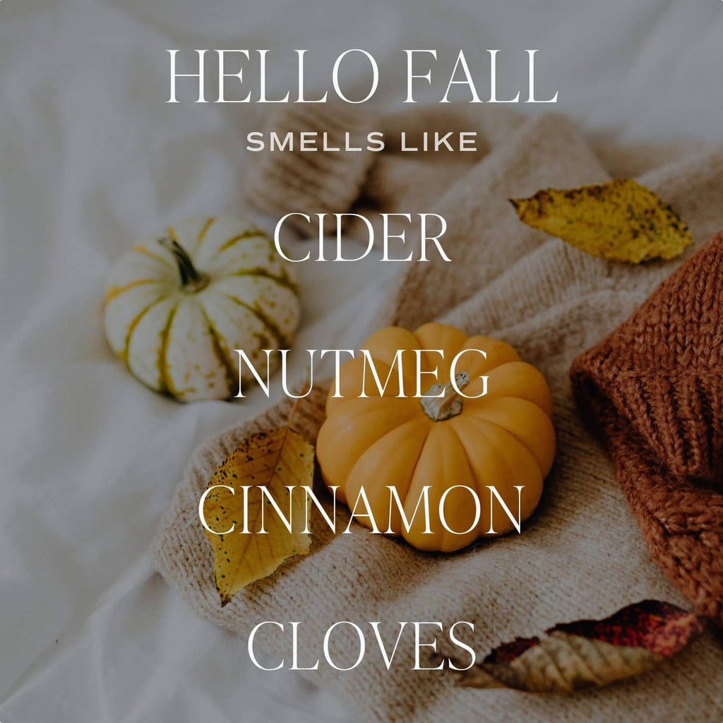 Jar candle close-up label: Hello Fall, with scent notes cider, nutmeg, cinnamon, and cloves