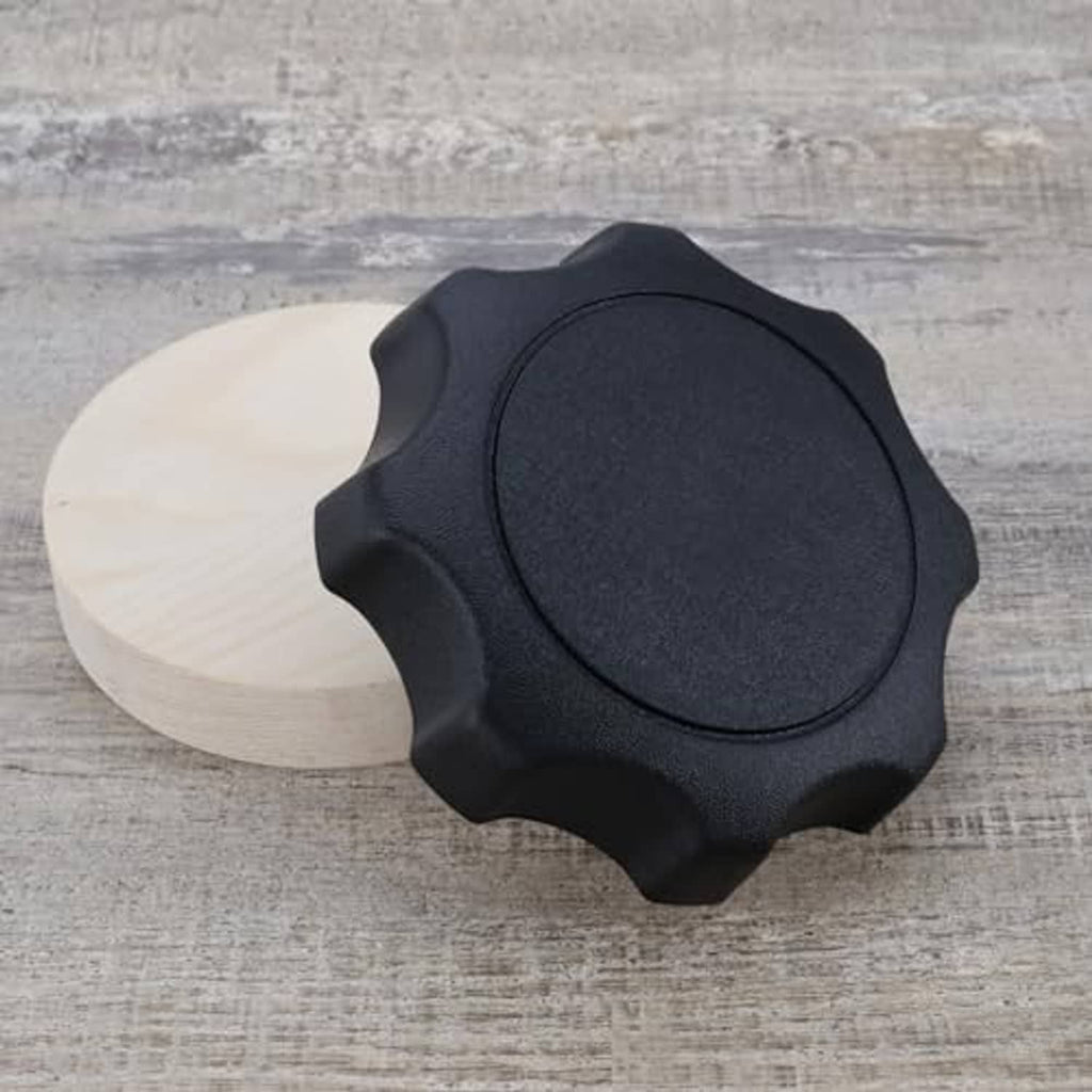 Black car seat adjustment handle knob, round center and textured star edges