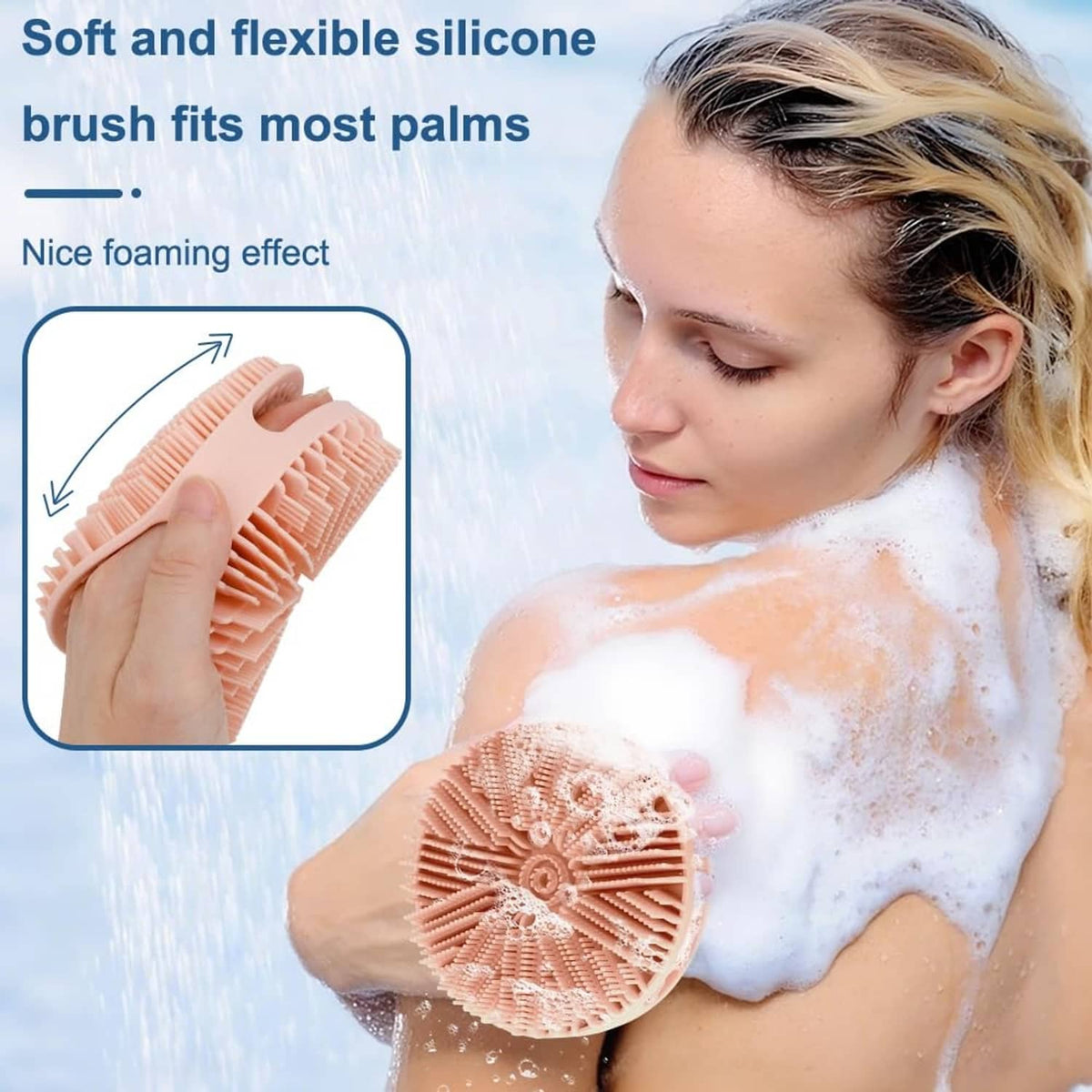 Peach-pink silicone bath scrubber with circular bristles, used with soap foam