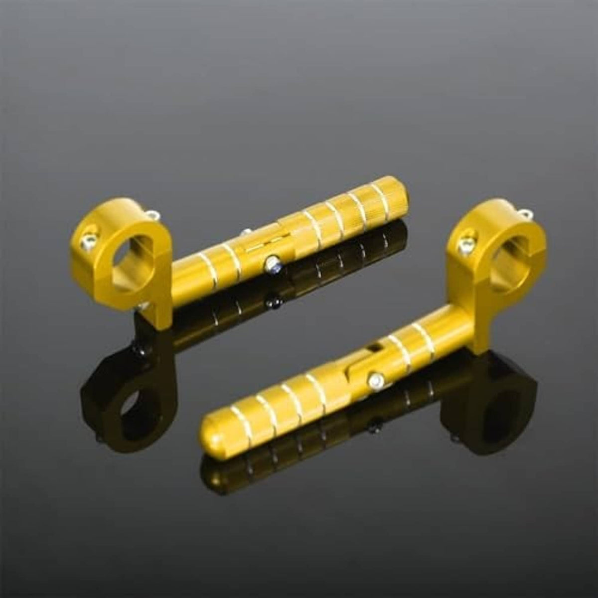 Gold folding rear passenger footrest pegs with textured silver grip sleeves