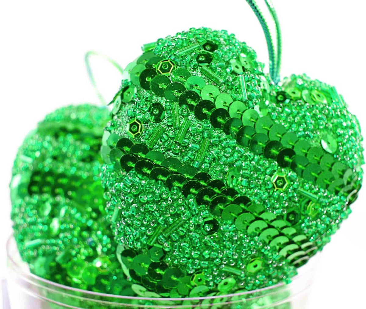 Bright green beaded charm with glittery sequin-like surface