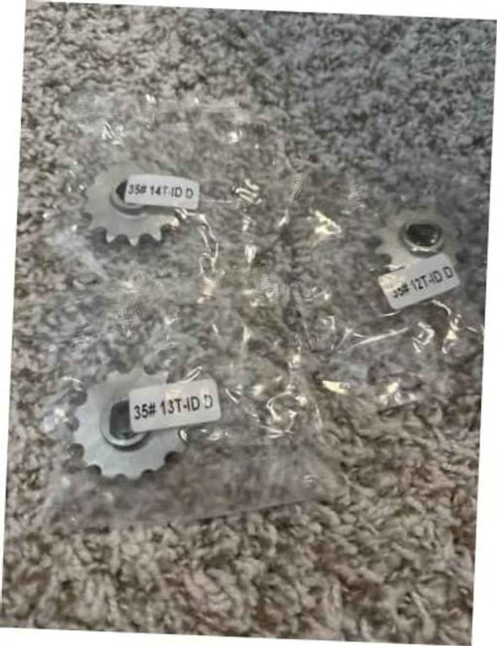 Silver 14T chain sprocket parts with stamped 35 markings