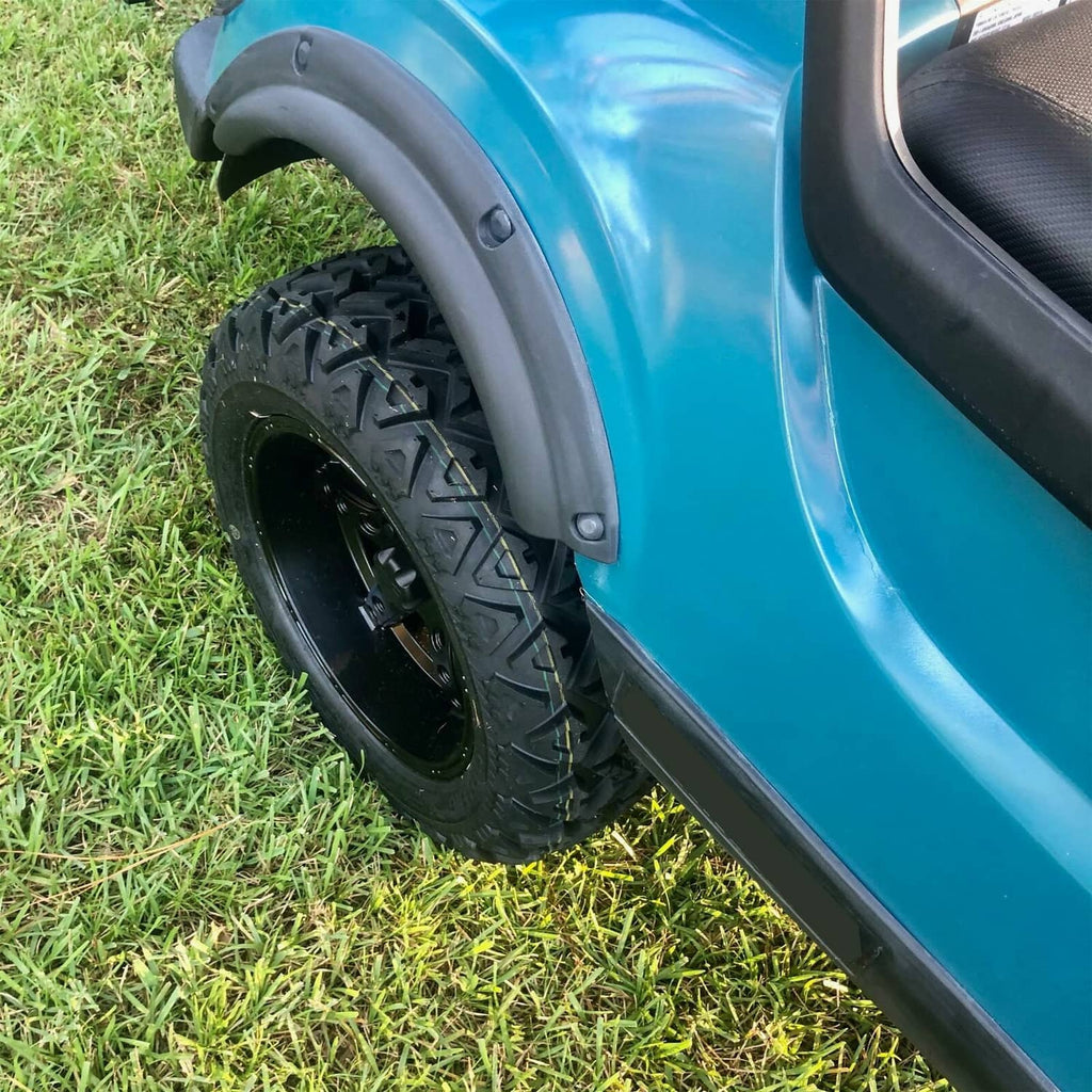 Single front wheel fender flare installed, black curved plastic with mounting holes