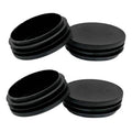 Set of black round plastic tube end caps, flat circular tops, open plug interiors