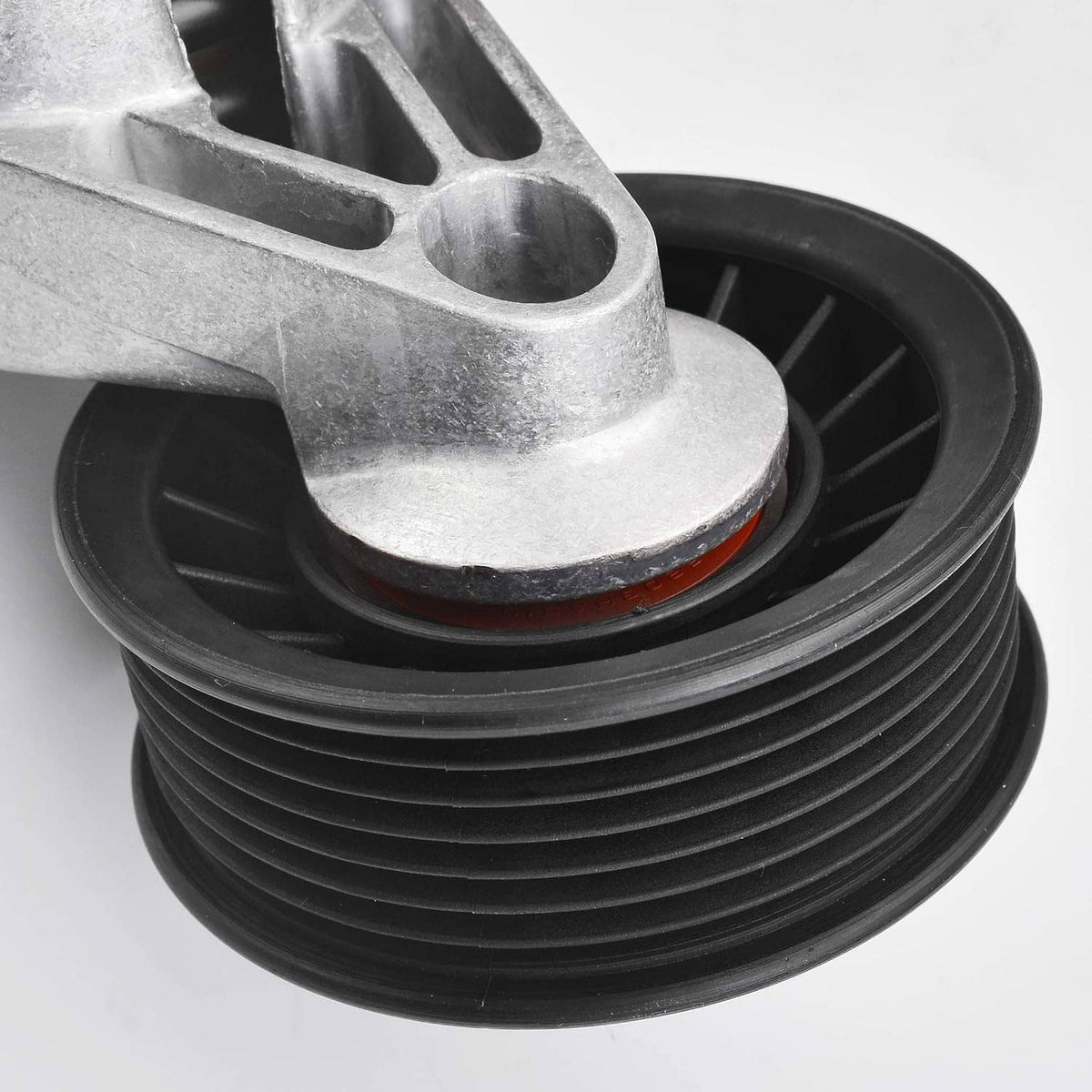 Automatic belt tensioner pulley with belt-contact rim and ribbed grooves