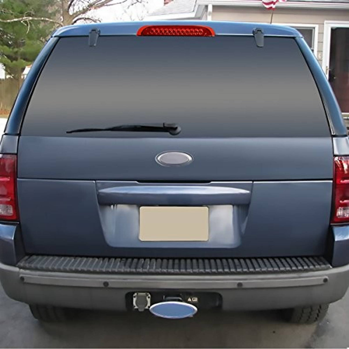 LED third brake light mounted on vehicle rear hatch with red lens strip
