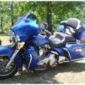 Black contoured driver and passenger motorcycle seat, padded with smooth upholstery.